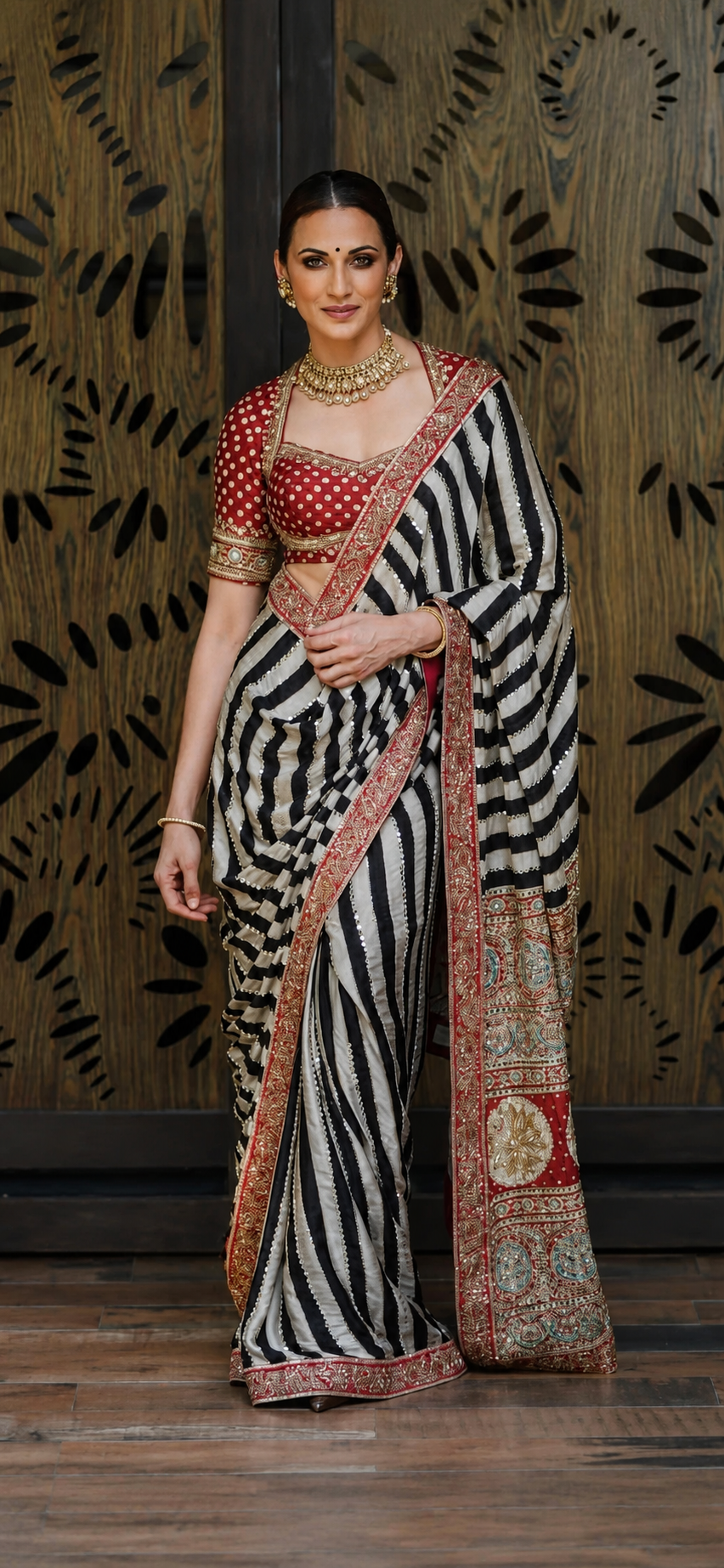Celebrity Inspired Silky Modal Satin Silk saree embellished with contemporary stripes ajrakh print embellished with original mirror handwork & contrast heavy mirror handwork bp