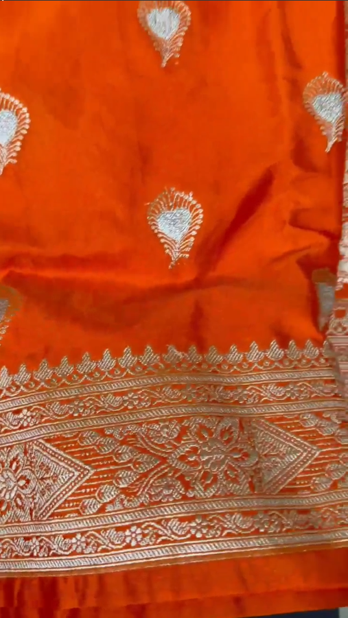 Beautiful Banarasi Mashru Silk Handloom Woven Saree featuring intricate traditional woven motifs, rich Banarasi craftsmanship, elegant border, luxurious drape, and matching blouse piece, perfect for weddings, festive occasions, and ethnic celebrations.