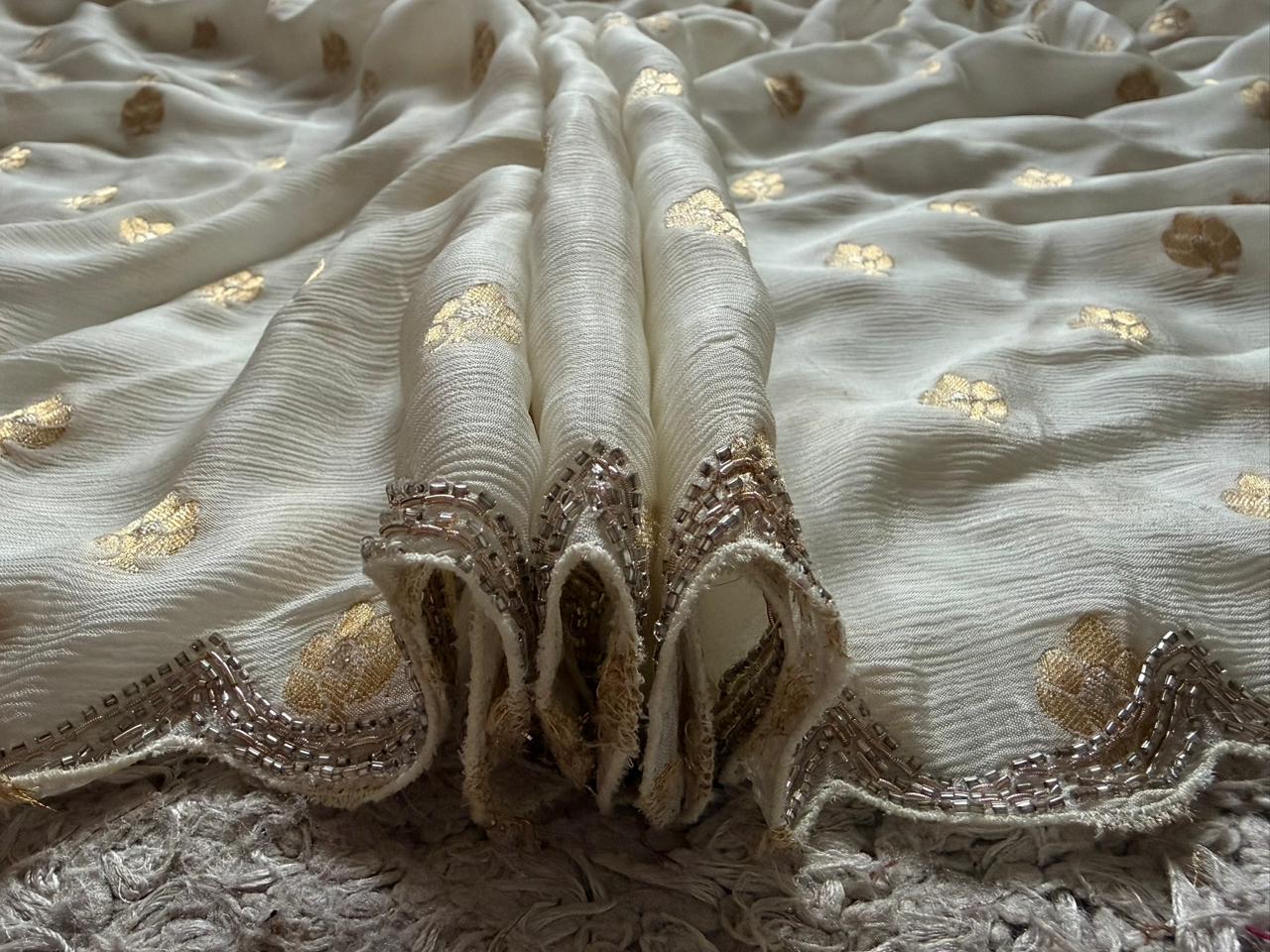 Premium pure chinnon silk saree with banarasi zari weaving motifs embellished with zardozi cut daana handwork & heavy jaal