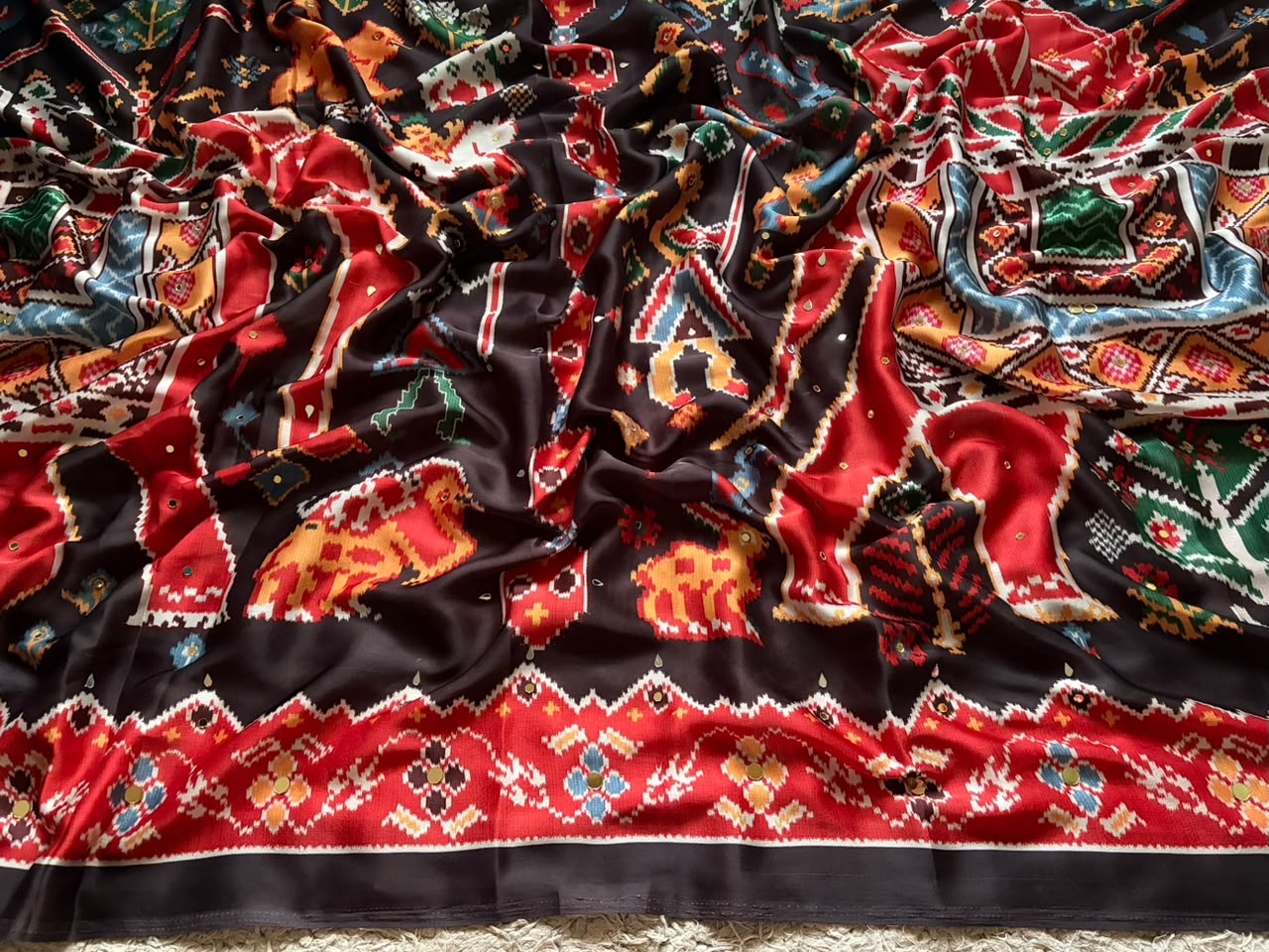 Celebrity inspired black patola silk saree embellished with contemporary gold n silver original mirror handwork