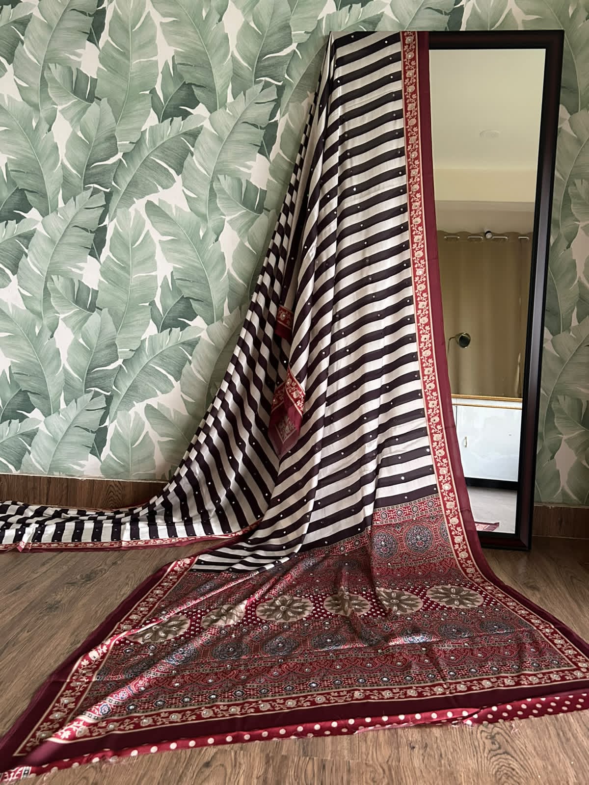 Celebrity Inspired Silky Modal Satin Silk saree embellished with contemporary stripes ajrakh print embellished with original mirror handwork & contrast heavy mirror handwork bp