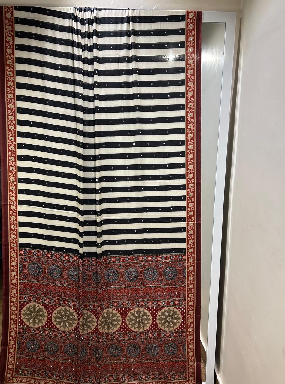 Celebrity Inspired Silky Modal Satin Silk saree embellished with contemporary stripes ajrakh print embellished with original mirror handwork & contrast heavy mirror handwork bp