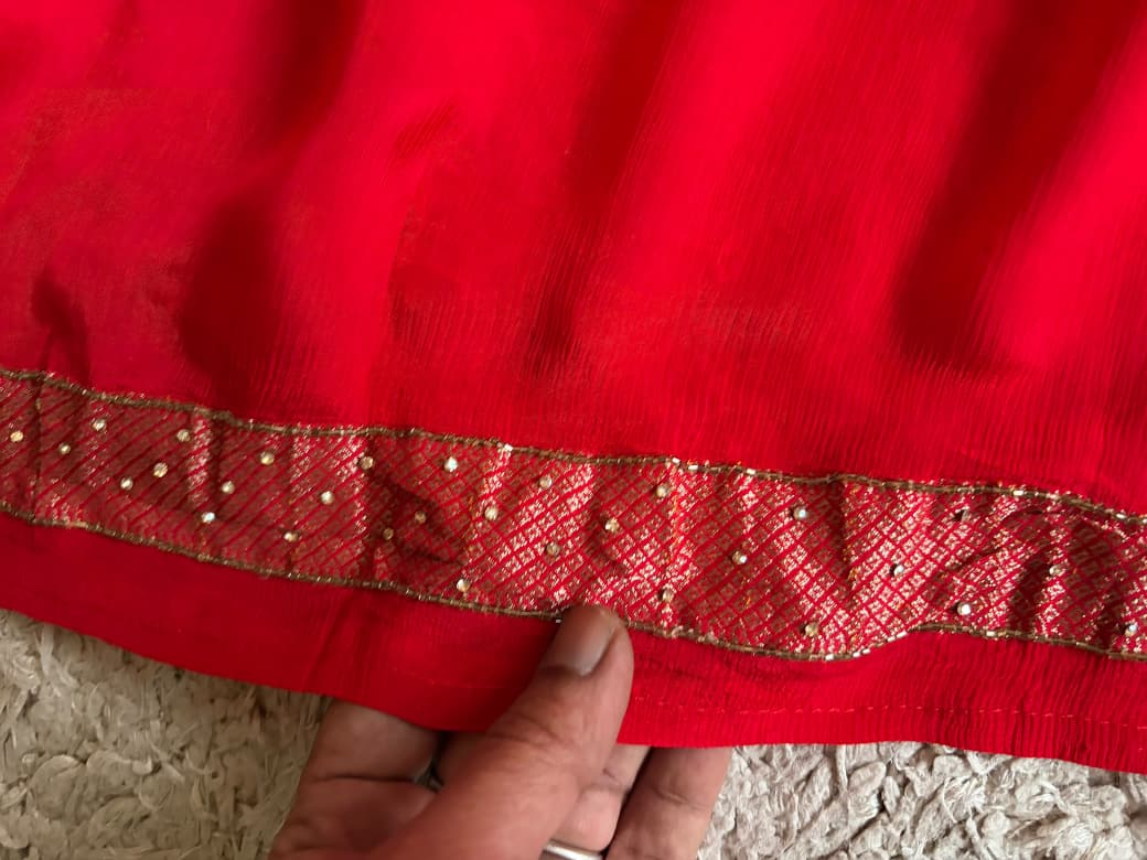Premium Pure Chinnon Silk Red saree with rich banarasi zari weaving floral motifs embellished with stone cut daana handwork & contrast/running bp