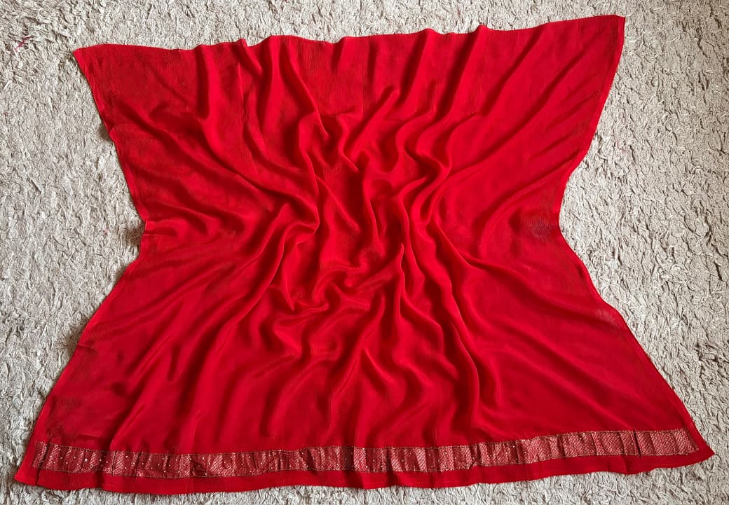 Premium Pure Chinnon Silk Red saree with rich banarasi zari weaving floral motifs embellished with stone cut daana handwork & contrast/running bp