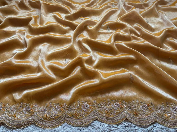 Golden Yellow Pure Zari Banarasi Tissue Silk sarees embellished with intricate zardozi handwork with running designer zardozi