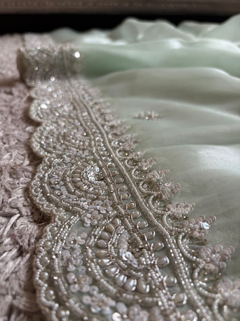 Premium Pure Tissue Organza Silk saree embellished with intricate scalloped silver zardozi handwork