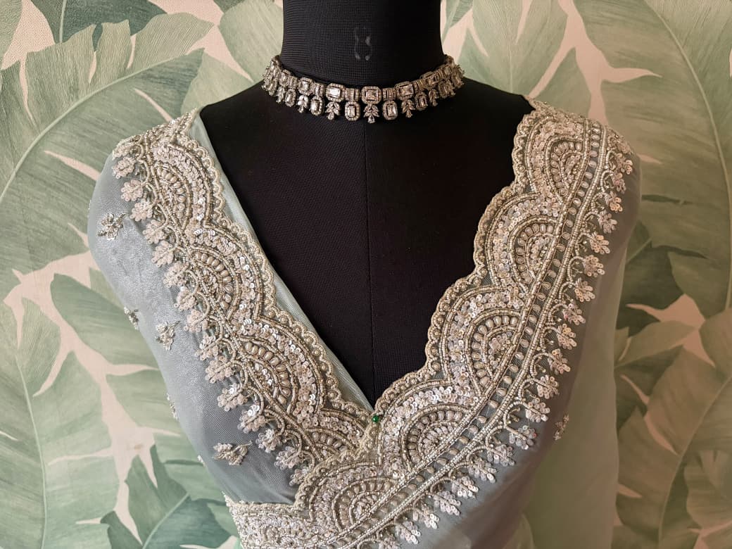Premium Pure Tissue Organza Silk saree embellished with intricate scalloped silver zardozi handwork