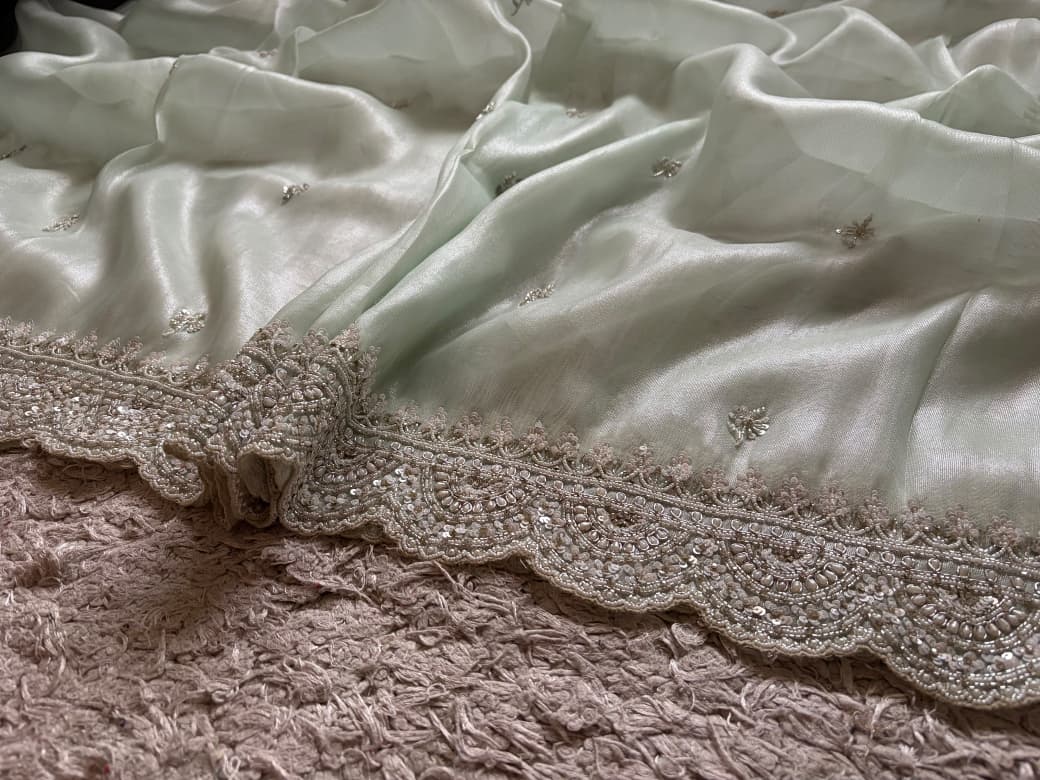 Premium Pure Tissue Organza Silk saree embellished with intricate scalloped silver zardozi handwork
