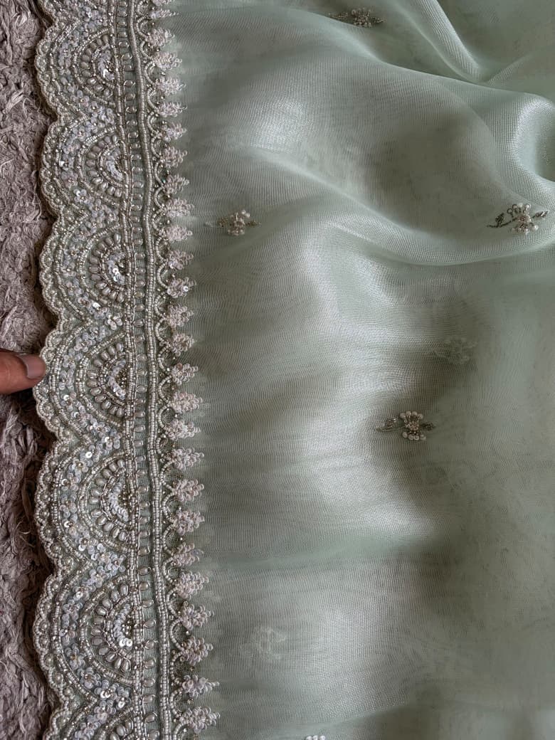 Premium Pure Tissue Organza Silk saree embellished with intricate scalloped silver zardozi handwork