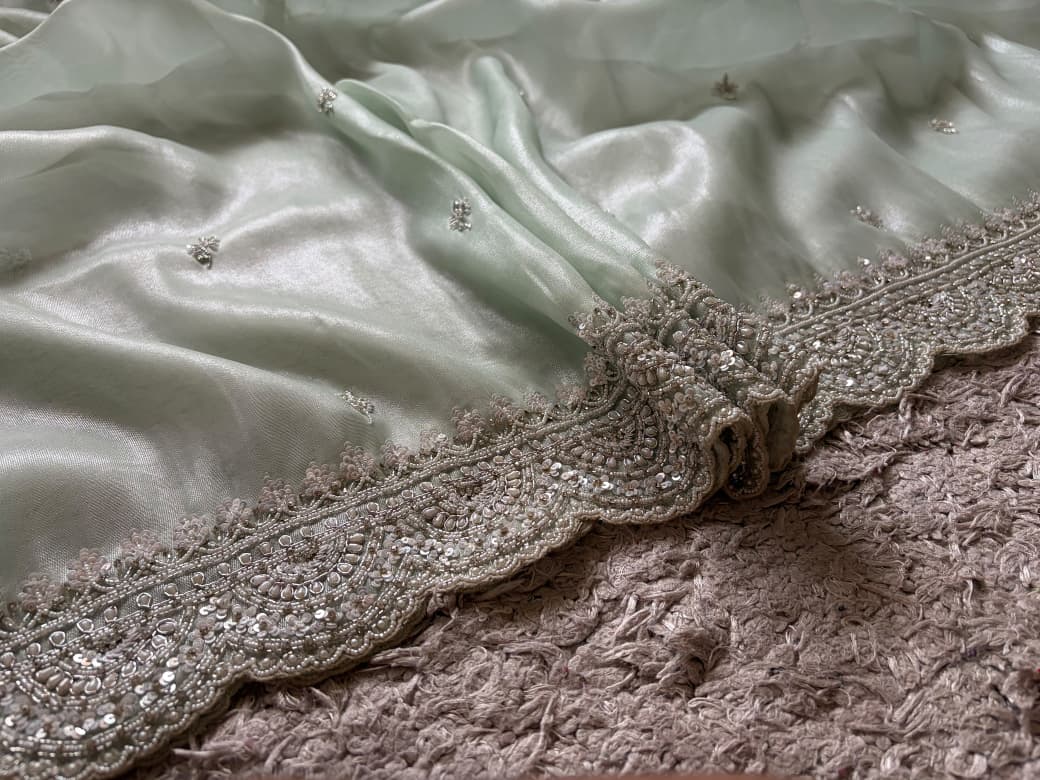 Premium Pure Tissue Organza Silk saree embellished with intricate scalloped silver zardozi handwork