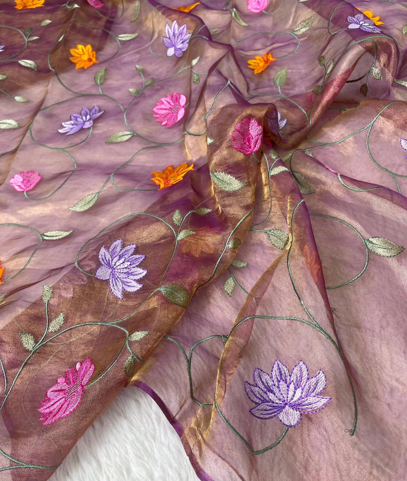 Banarasi Pure Tissue Saree adorned with intricate embroidery, enriched with luxurious silver zari weaving