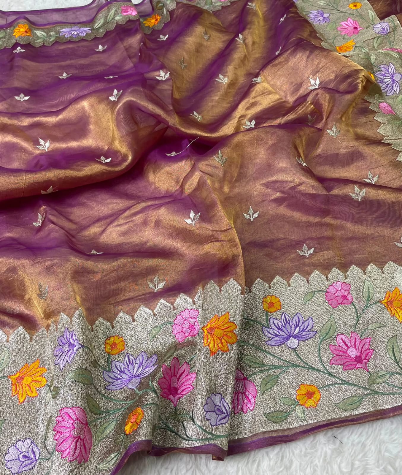 Banarasi Pure Tissue Saree adorned with intricate embroidery, enriched with luxurious silver zari weaving