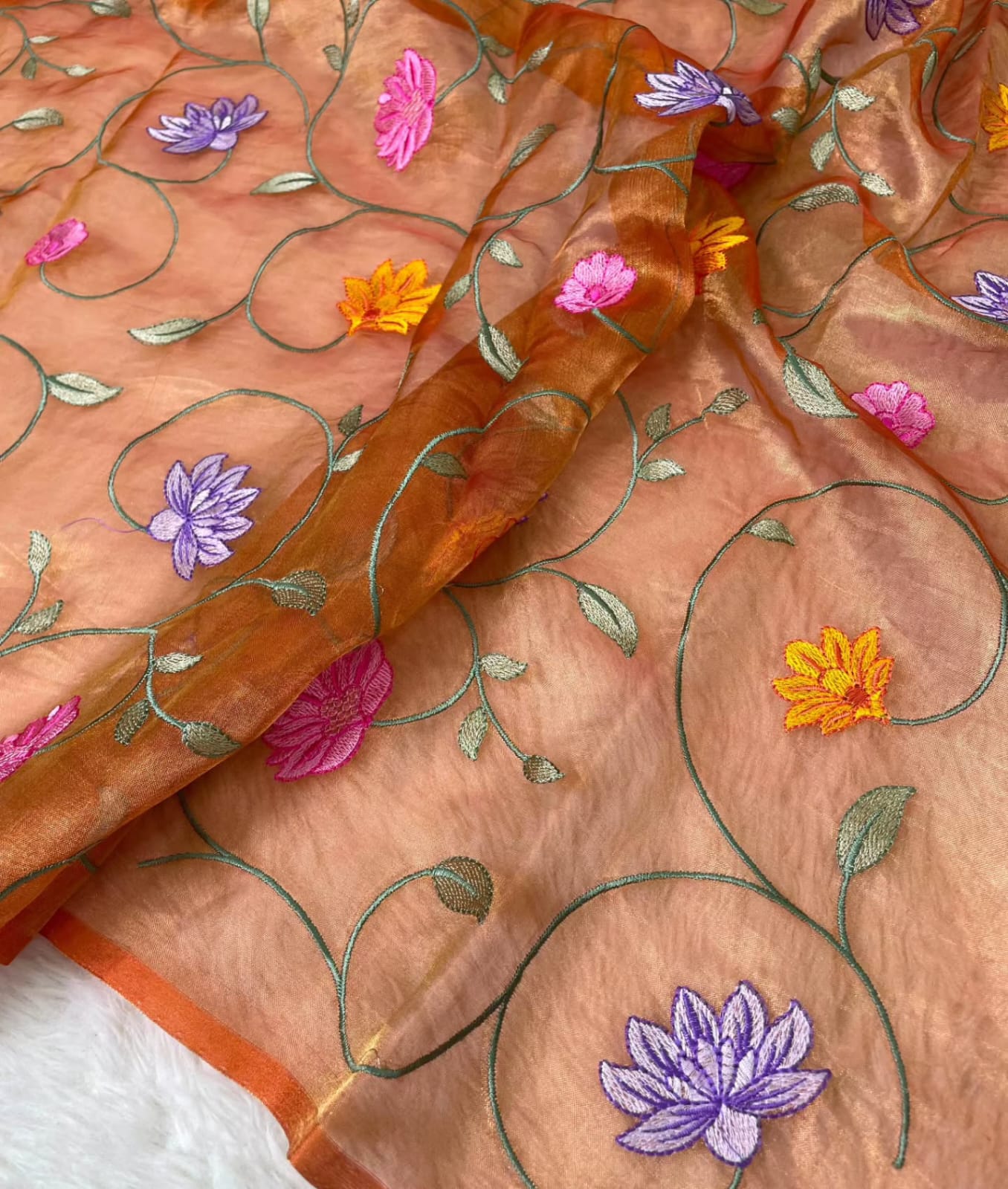 Banarasi Pure Tissue Saree adorned with intricate embroidery, enriched with luxurious silver zari weaving.
