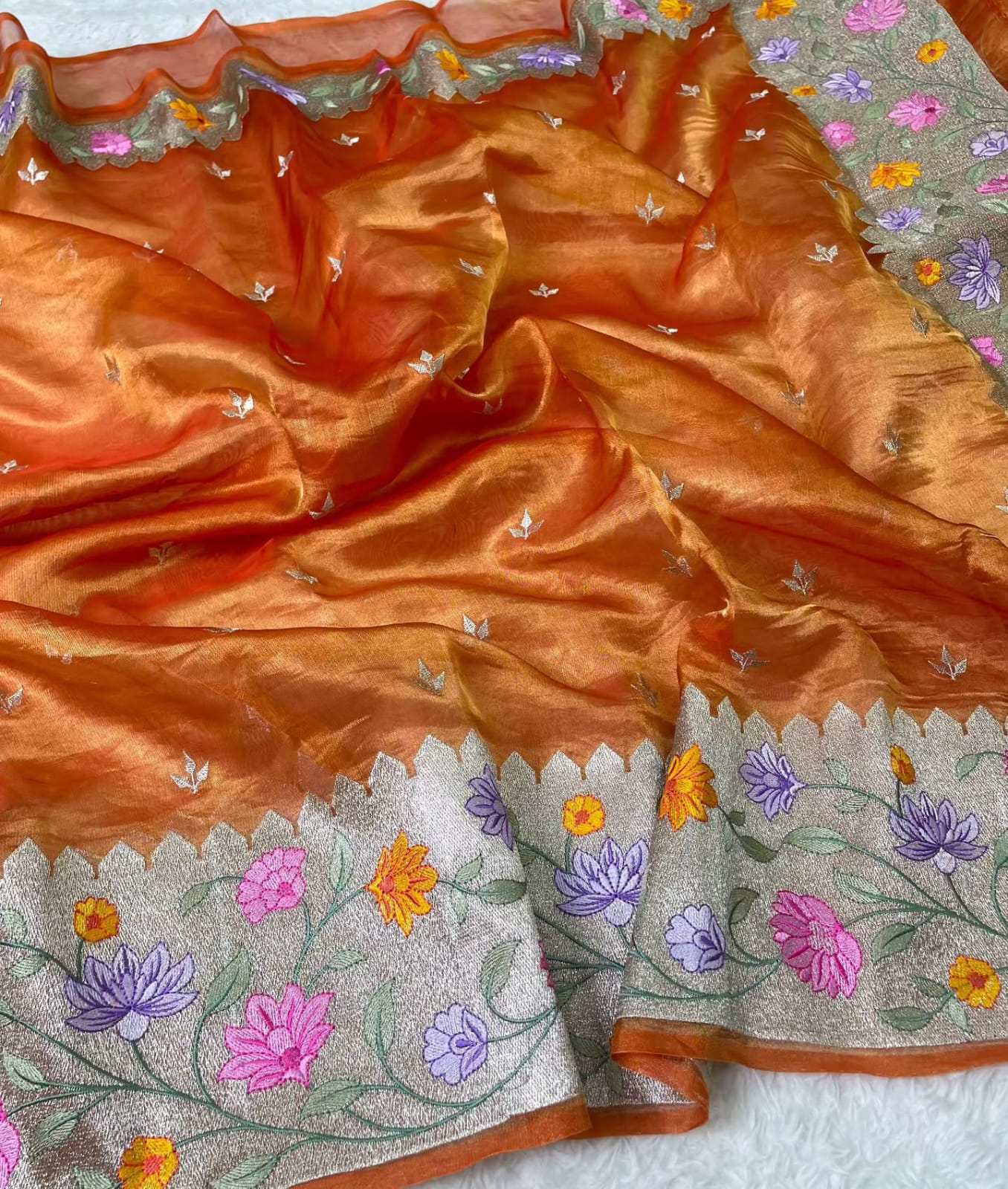 Banarasi Pure Tissue Saree adorned with intricate embroidery, enriched with luxurious silver zari weaving.