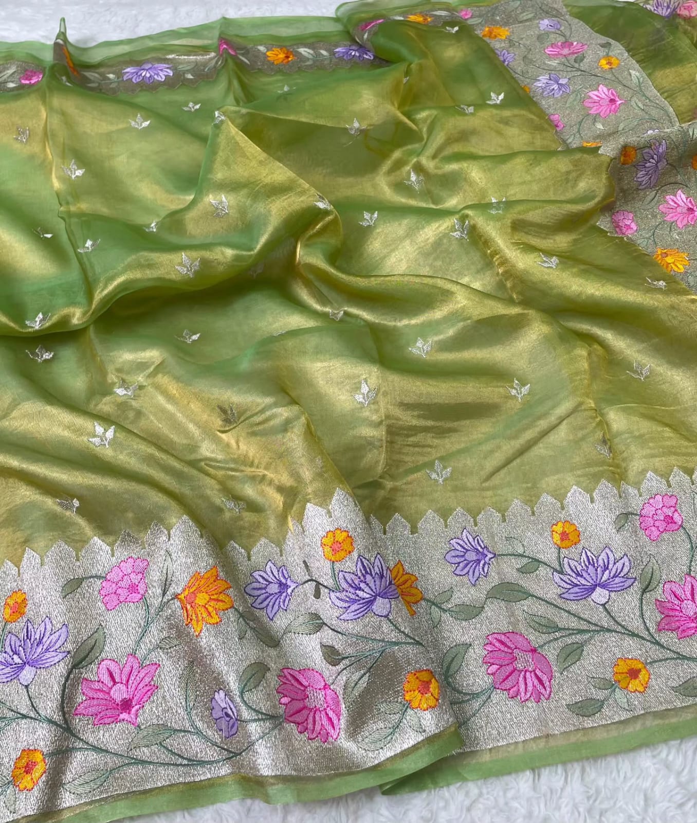 Banarasi Pure Tissue Saree adorned with intricate embroidery, enriched with luxurious silver zari weaving.