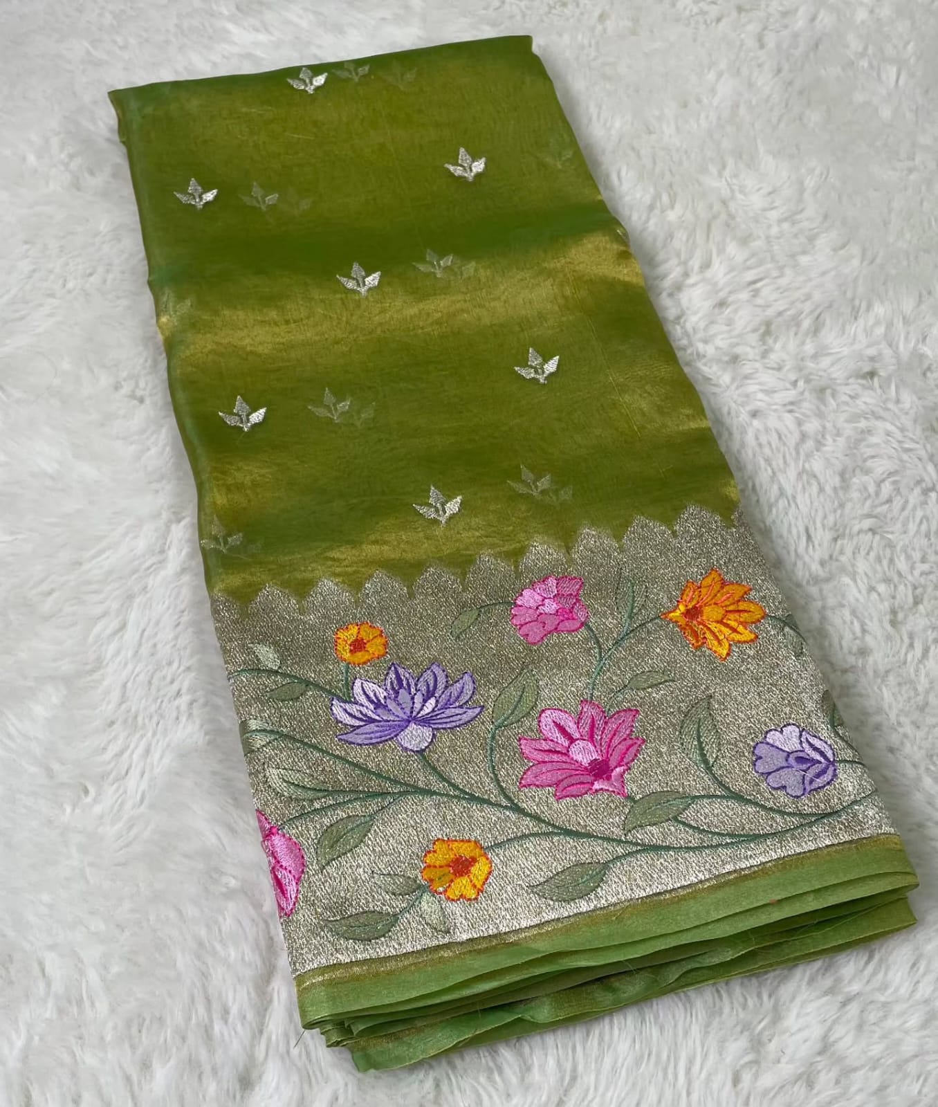 Banarasi Pure Tissue Saree adorned with intricate embroidery, enriched with luxurious silver zari weaving.