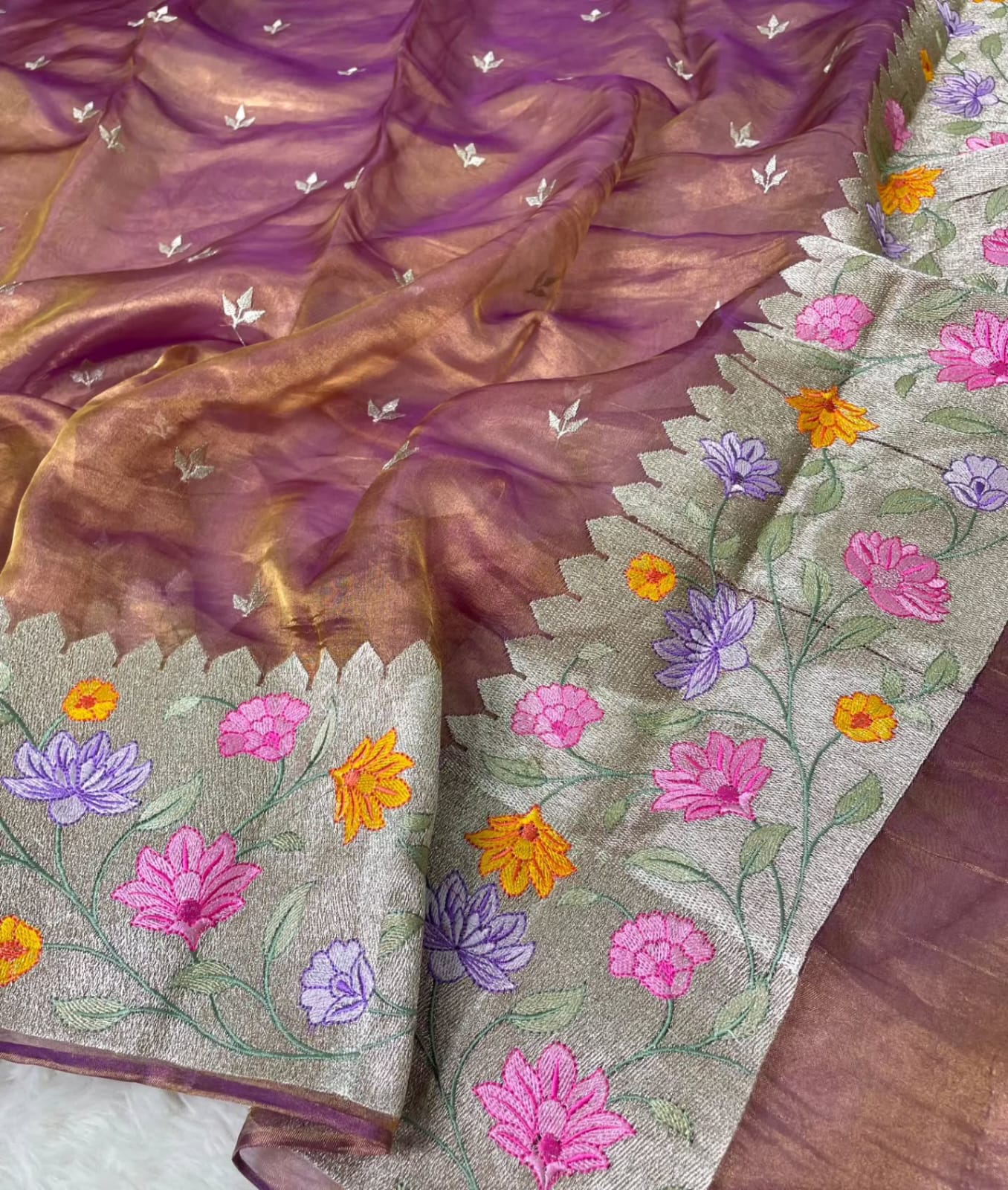 Banarasi Pure Tissue Saree adorned with intricate embroidery, enriched with luxurious silver zari weaving