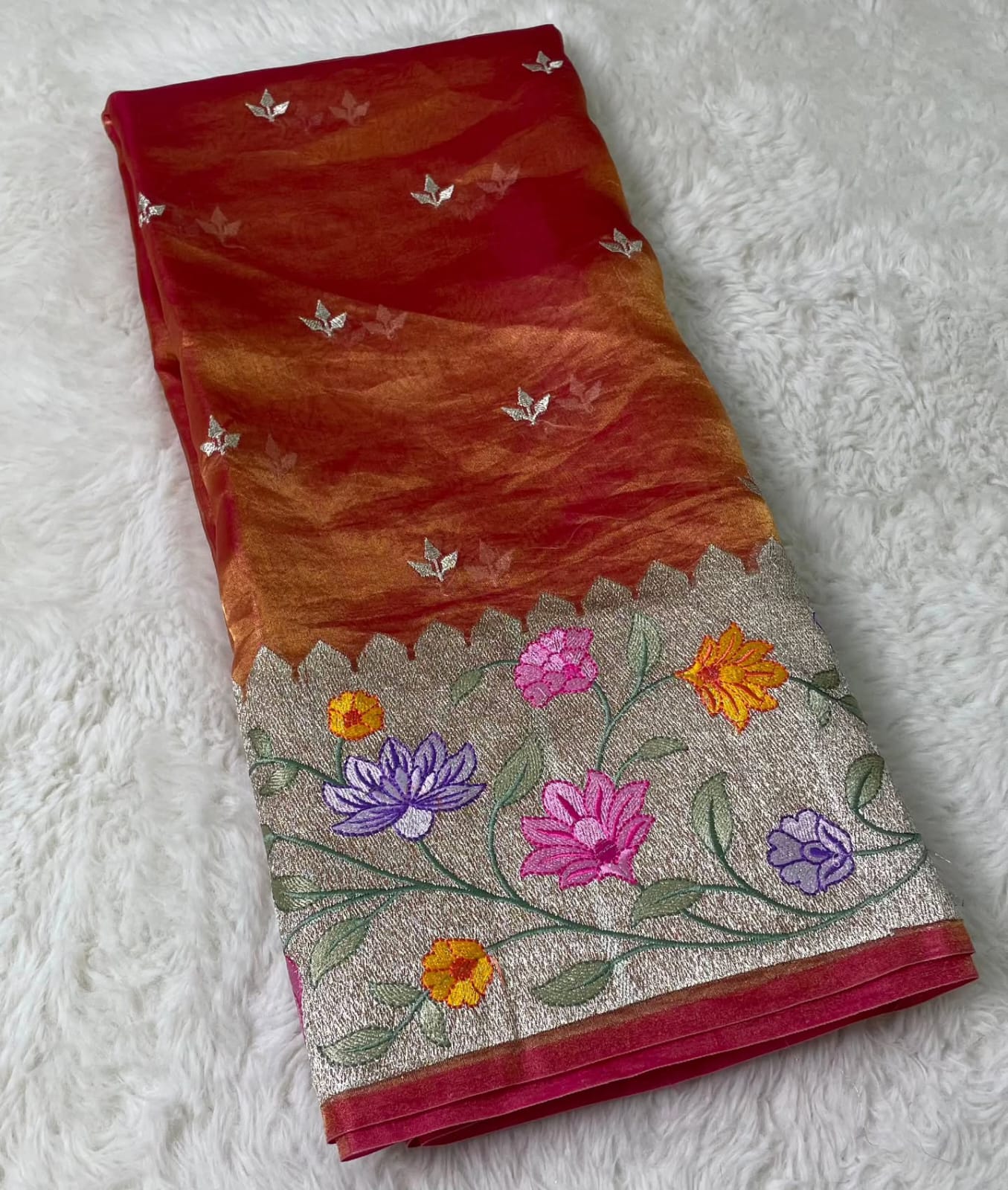 Banarasi Pure Tissue Saree adorned with intricate embroidery, enriched with luxurious silver zari weaving.