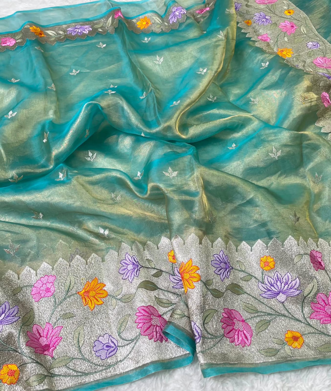 Banarasi Pure Tissue Saree adorned with intricate embroidery, enriched with luxurious silver zari weaving.