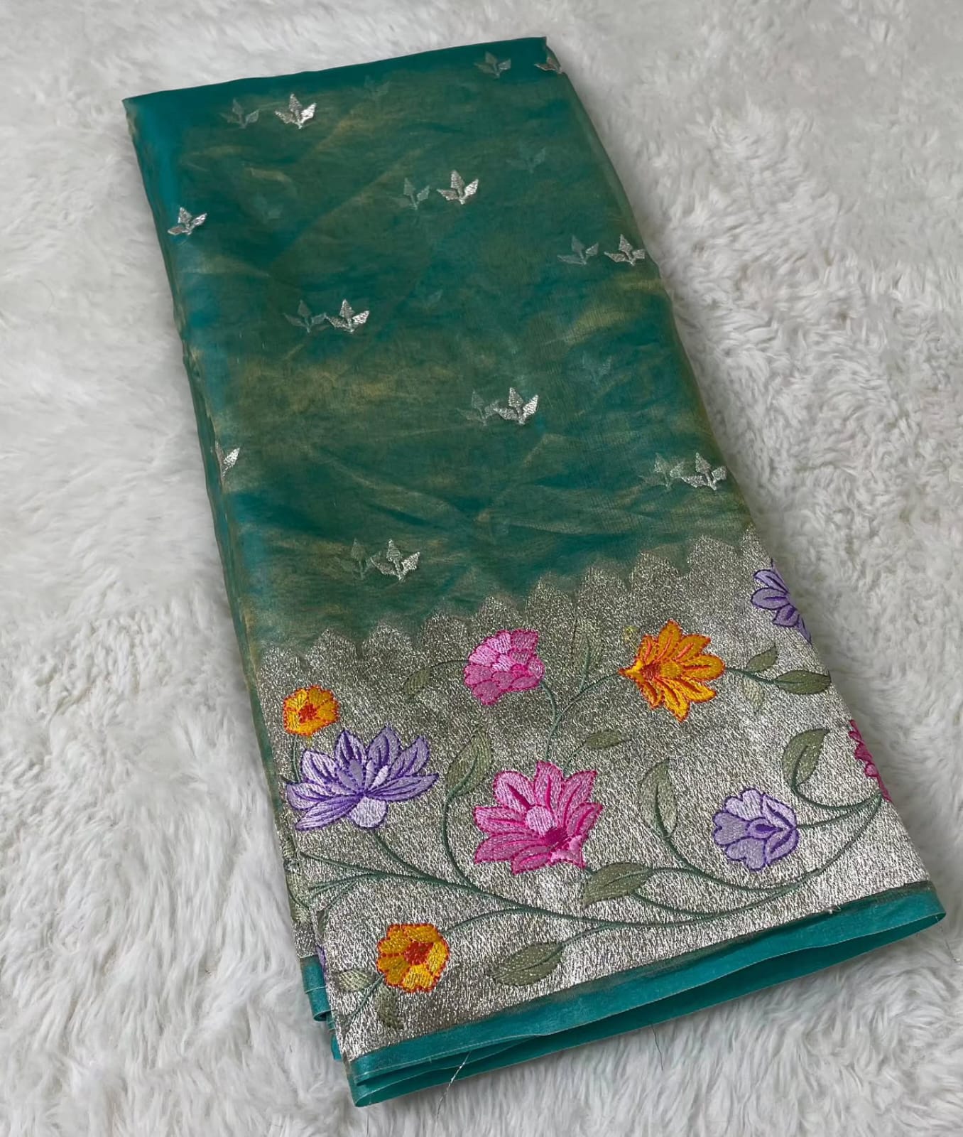 Banarasi Pure Tissue  Blue Saree adorned with intricate embroidery, enriched with luxurious silver zari weaving.