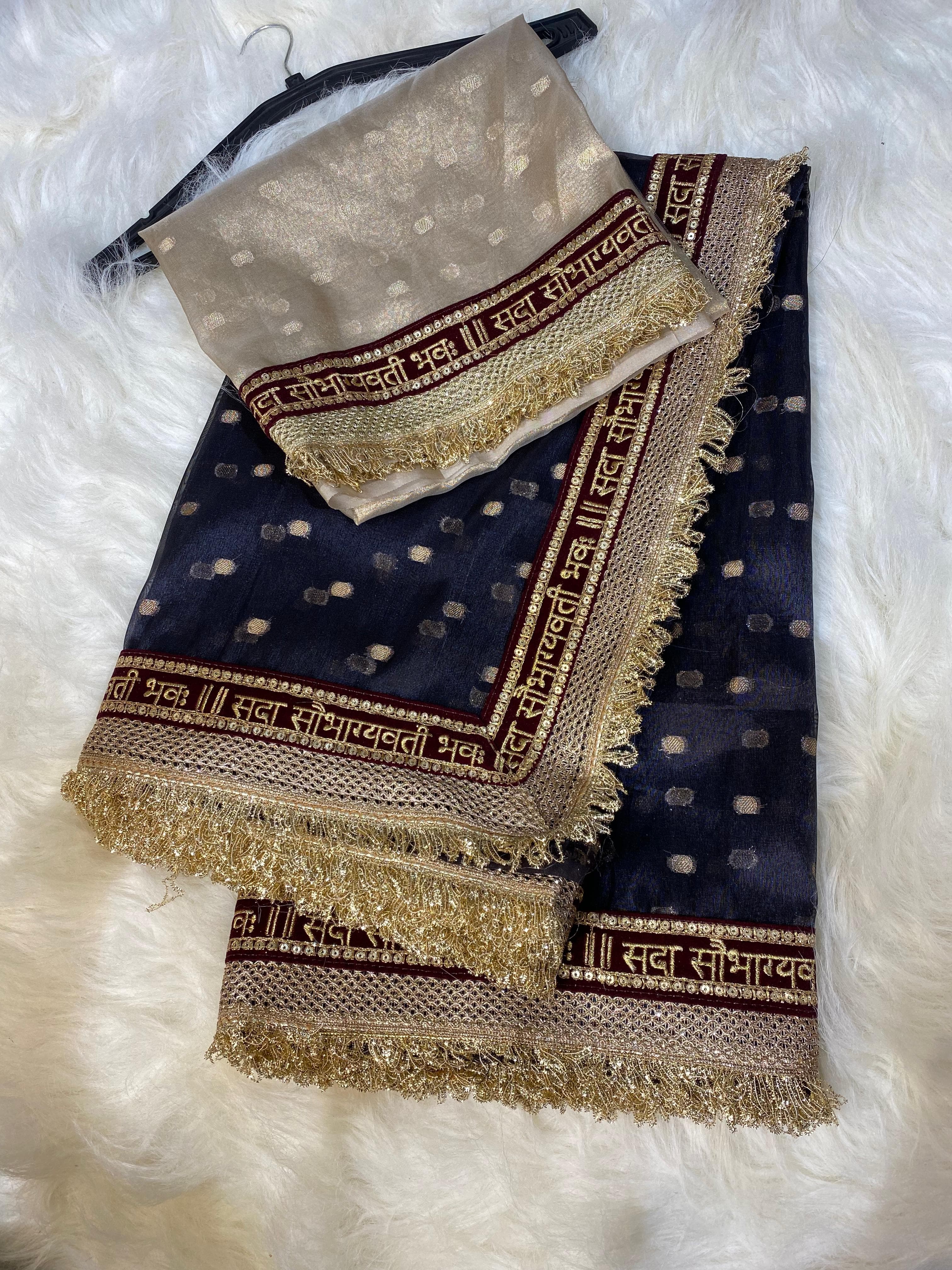 Beautiful Banarasi Soft Tissue Navy blue SSilk Dulhan Ki Saree with luxurious Banarasi weaving, elegant bridal design, and rich traditional look for weddings and festive occasions.lver