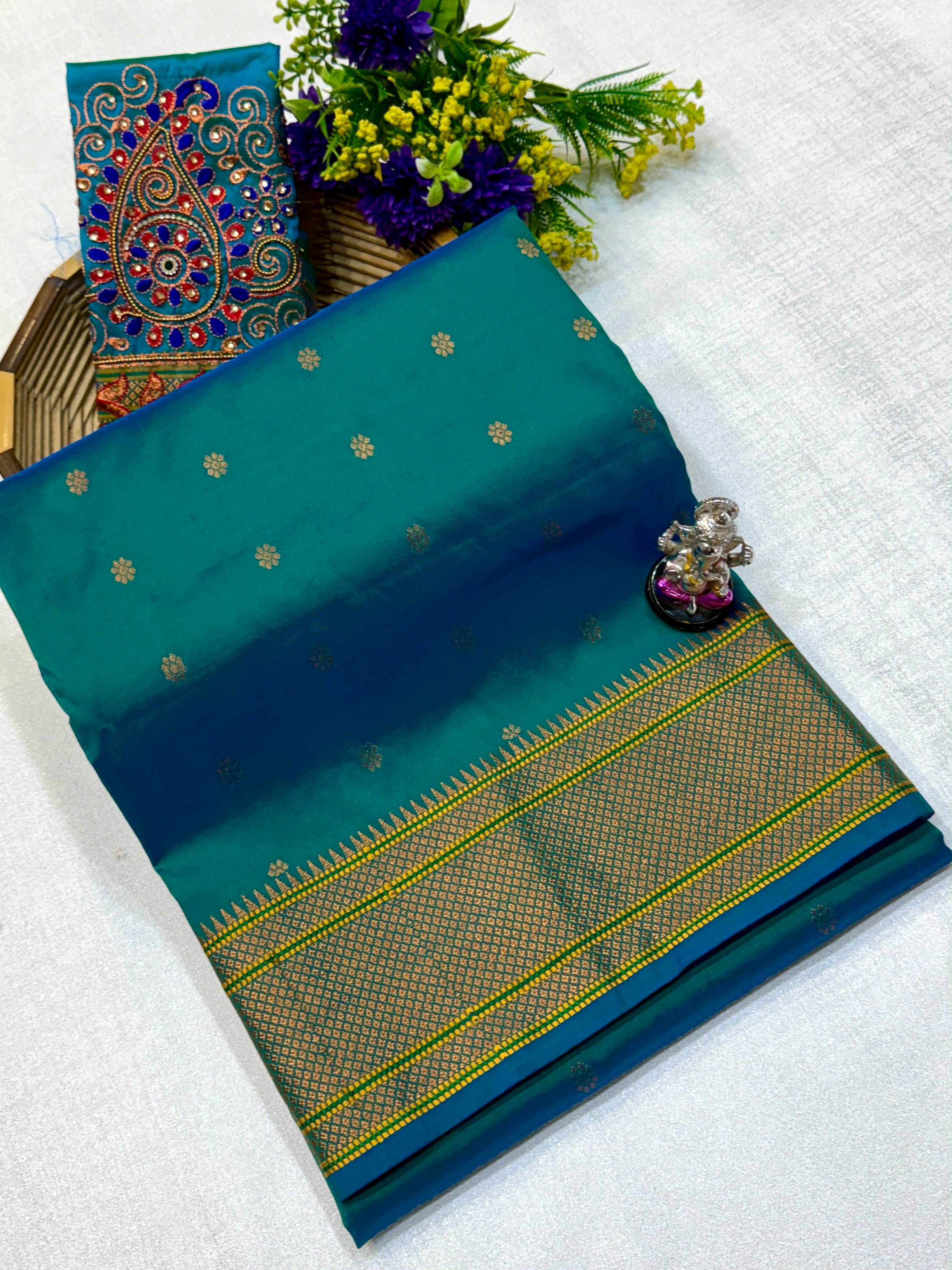 Kajal Kalanjali Paithani premium Tana silk saree with allover zari butti and rich zari pallu.