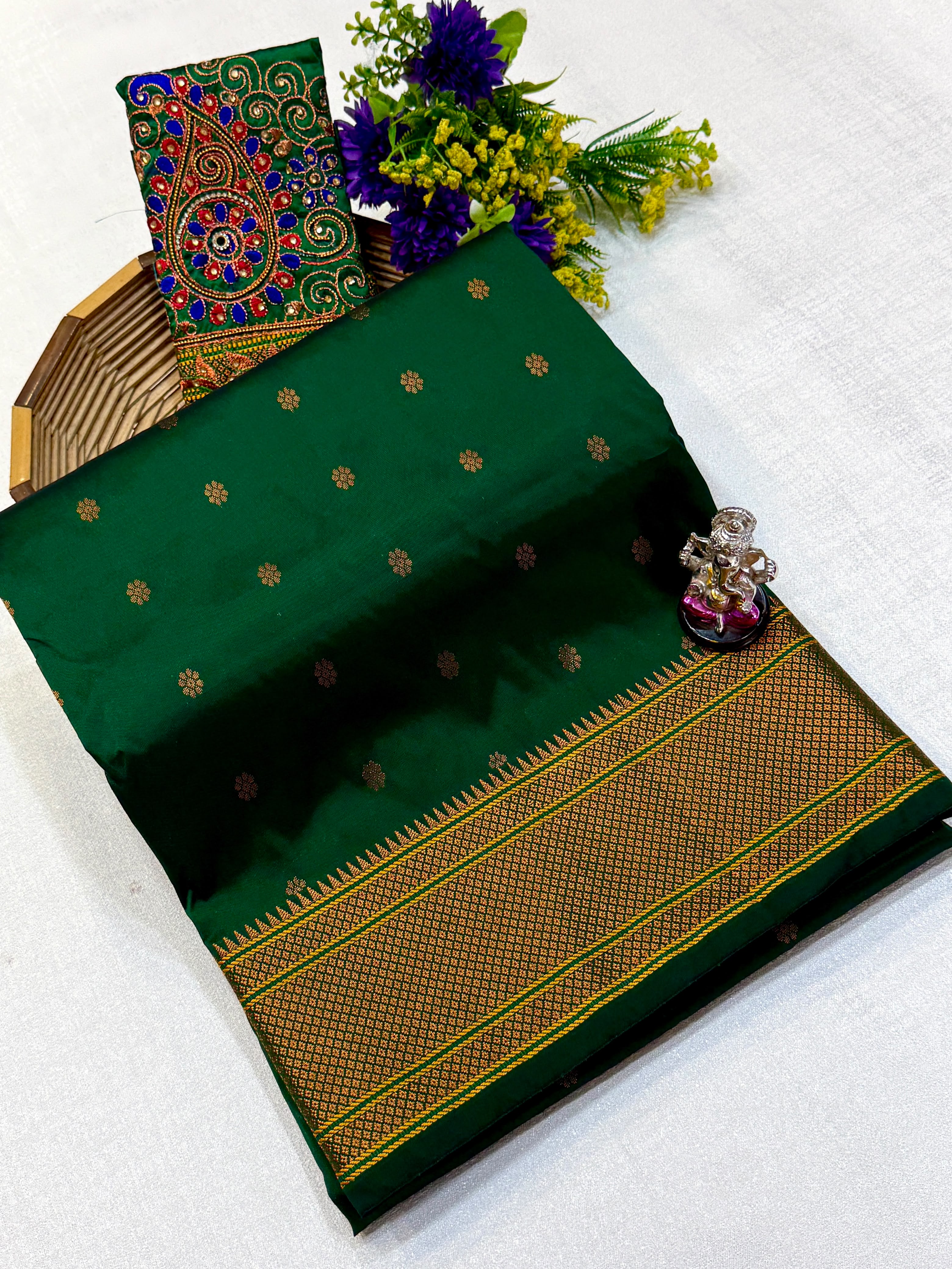 Kajal Kalanjali Paithani premium Tana silk saree with allover zari butti and rich zari pallu.