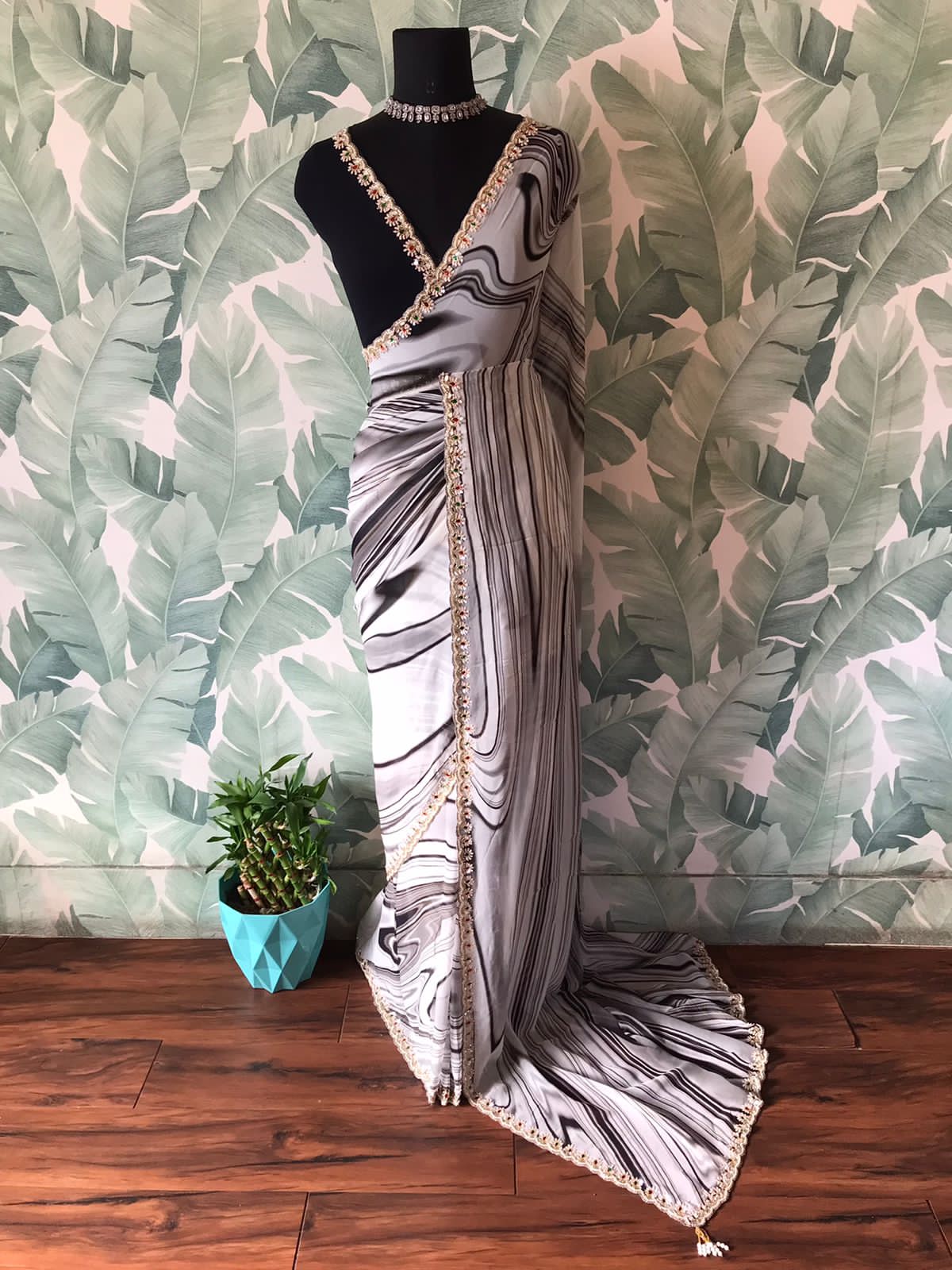 Black and white premium pure georgette silk saree with contemporary digital print, mirror sequins pearl cut daana handwork and contrast black blouse.