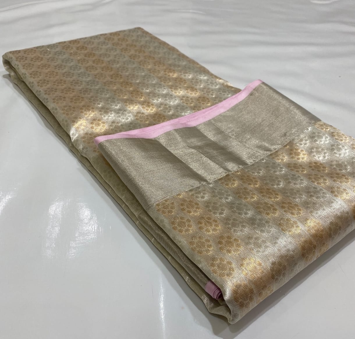 Ivory White Chanderi Handloom Pattu Tissue Silk Saree With Gold Zari Woven Motifs, Elegant Tissue Finish, Rich Woven Border And Matching Blouse Piece.