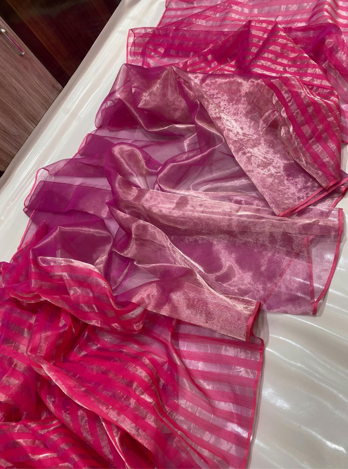 Rani Pink Chanderi Handloom Pattu Tissue Silk Saree With Golden Tissue Finish, Zari Woven Striped Pallu, Elegant Border And Matching Blouse Piece.