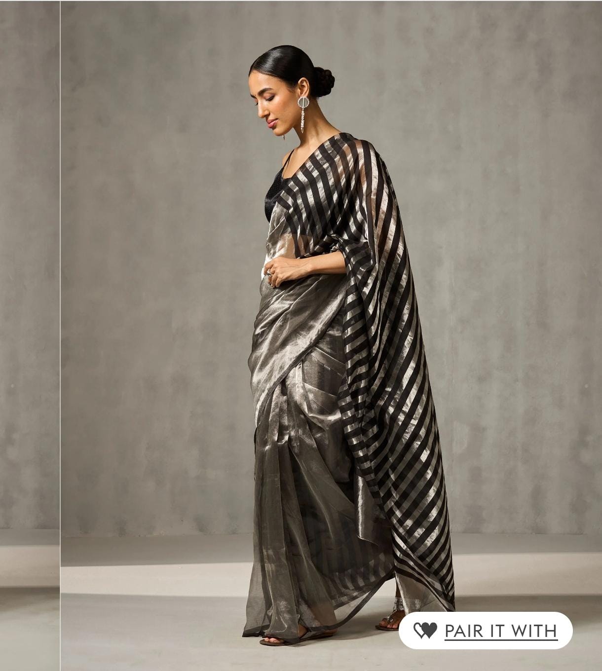 Silver Chanderi Handloom Pattu Tissue Silk Saree With Elegant Black Striped Weaving, Rich Tissue Finish, Stylish Woven Border And Matching Blouse Piece.