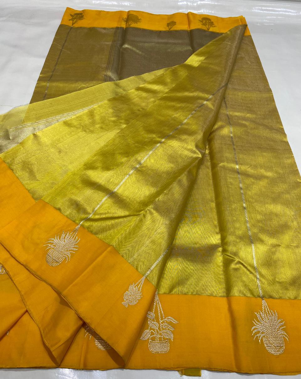 Golden Chanderi Handloom Pattu Tissue Silk Saree With Silver Zari Woven Motifs, Contrast Yellow Border, Rich Tissue Finish And Matching Blouse Piece.