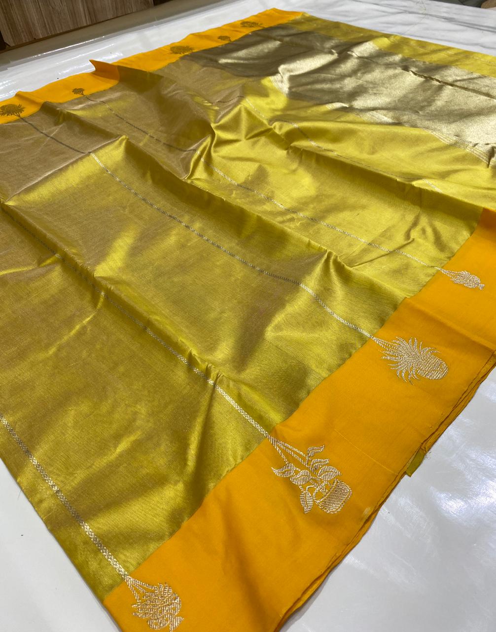 Golden Chanderi Handloom Pattu Tissue Silk Saree With Silver Zari Woven Motifs, Contrast Yellow Border, Rich Tissue Finish And Matching Blouse Piece.