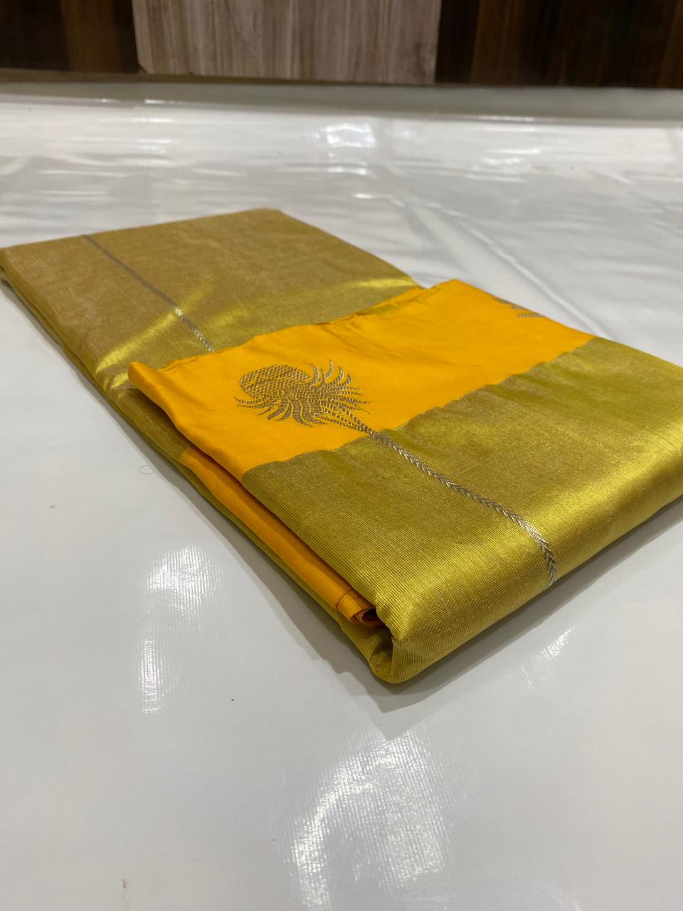 Golden Chanderi Handloom Pattu Tissue Silk Saree With Silver Zari Woven Motifs, Contrast Yellow Border, Rich Tissue Finish And Matching Blouse Piece.