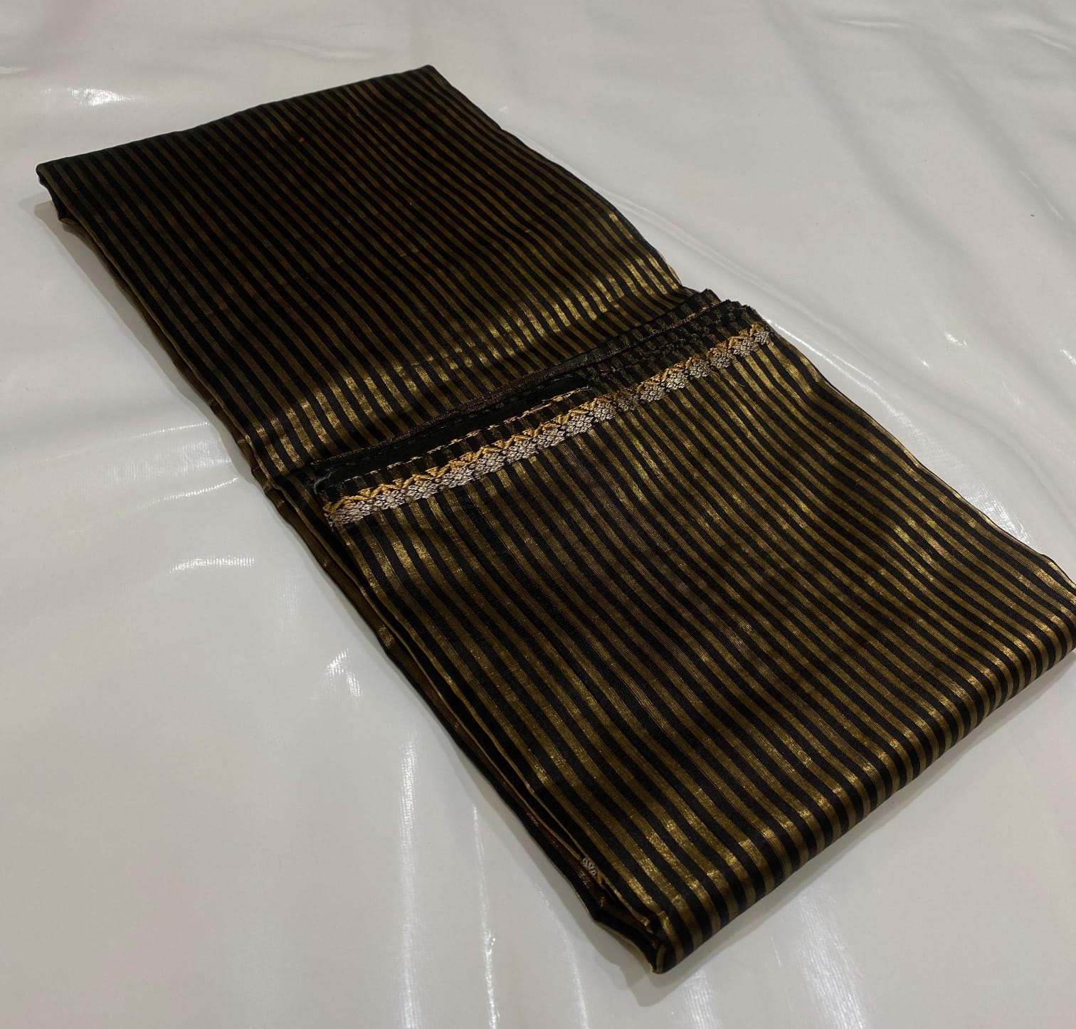 Black Chanderi Handloom Pattu Silk Saree With Blouse Featuring Elegant Golden Striped Weave Design And Traditional Festive Look.