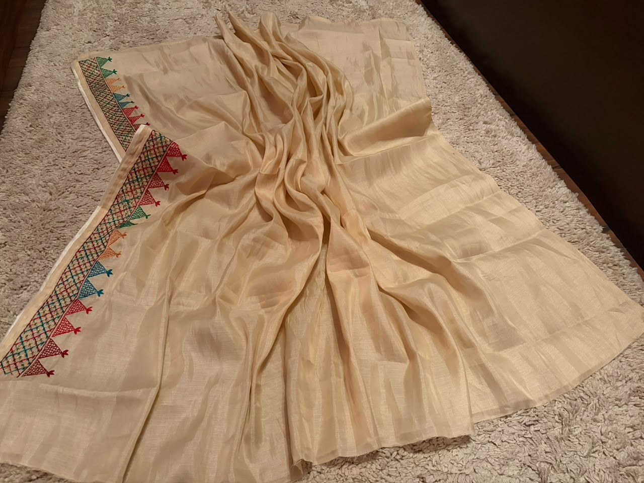 Classy Cream Premium Tussar Silk saree embellished with multi coloured resham thread charismatic Lambani (Banjara) work