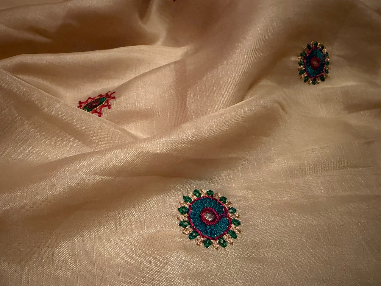 Classy Cream Premium Tussar Silk saree embellished with multi coloured resham thread charismatic Lambani (Banjara) work