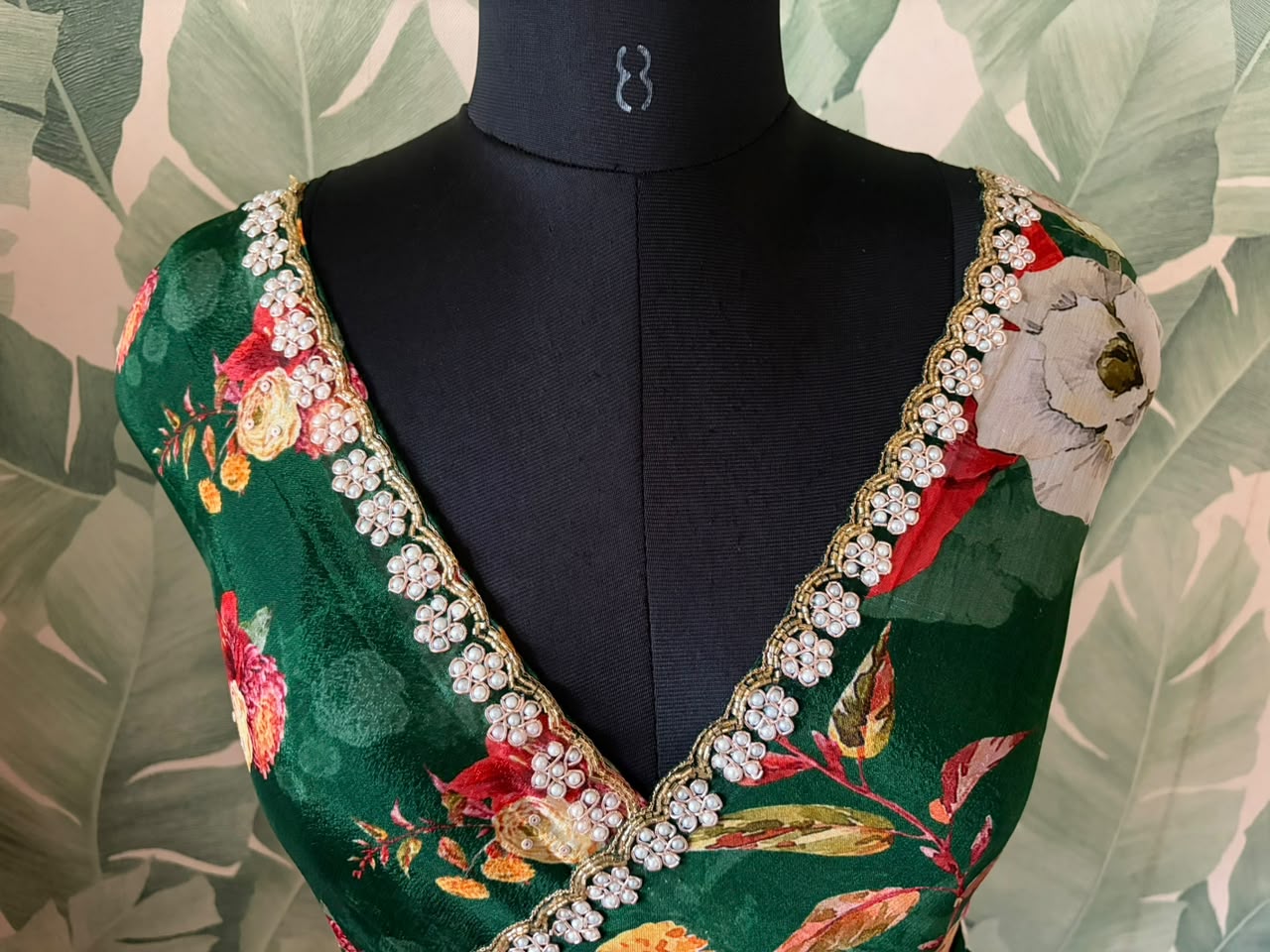 Premium Pure Chinnon Crepe Silk Saree in emerald green with elegant floral digital print, embellished with intricate zardozi, pearl, and cut daana handwork border, paired with a matching Pure Chinnon handwork blouse piece for weddings, festive occasions, and party wear.