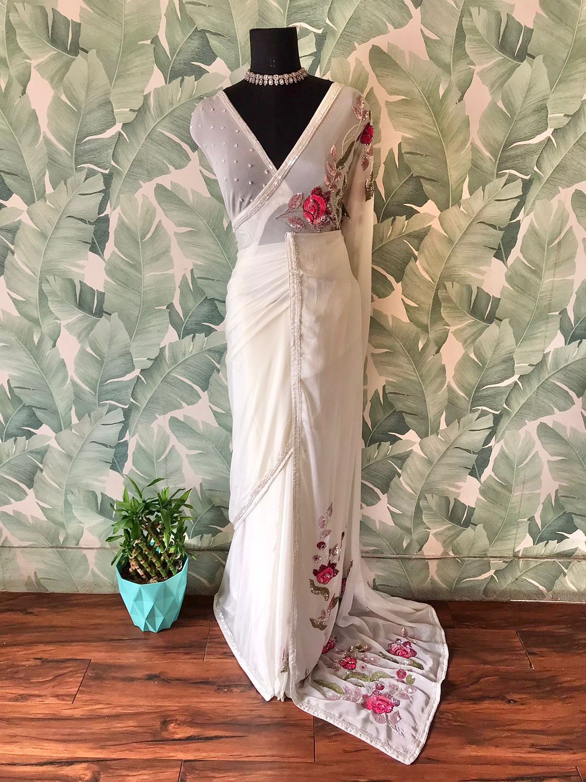 “White Premium Chinnon Crepe Silk Saree with Multicoloured Floral Sequins & Cut-Dana Work”