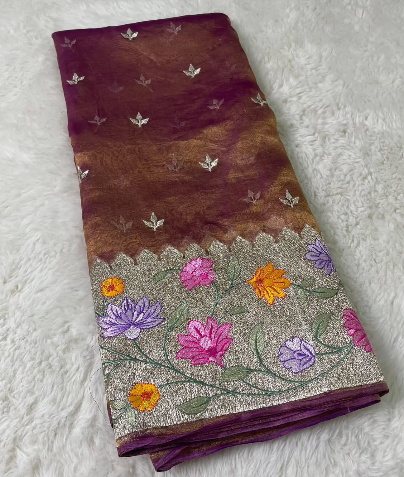 Banarasi Pure Tissue Saree adorned with intricate embroidery, enriched with luxurious silver zari weaving