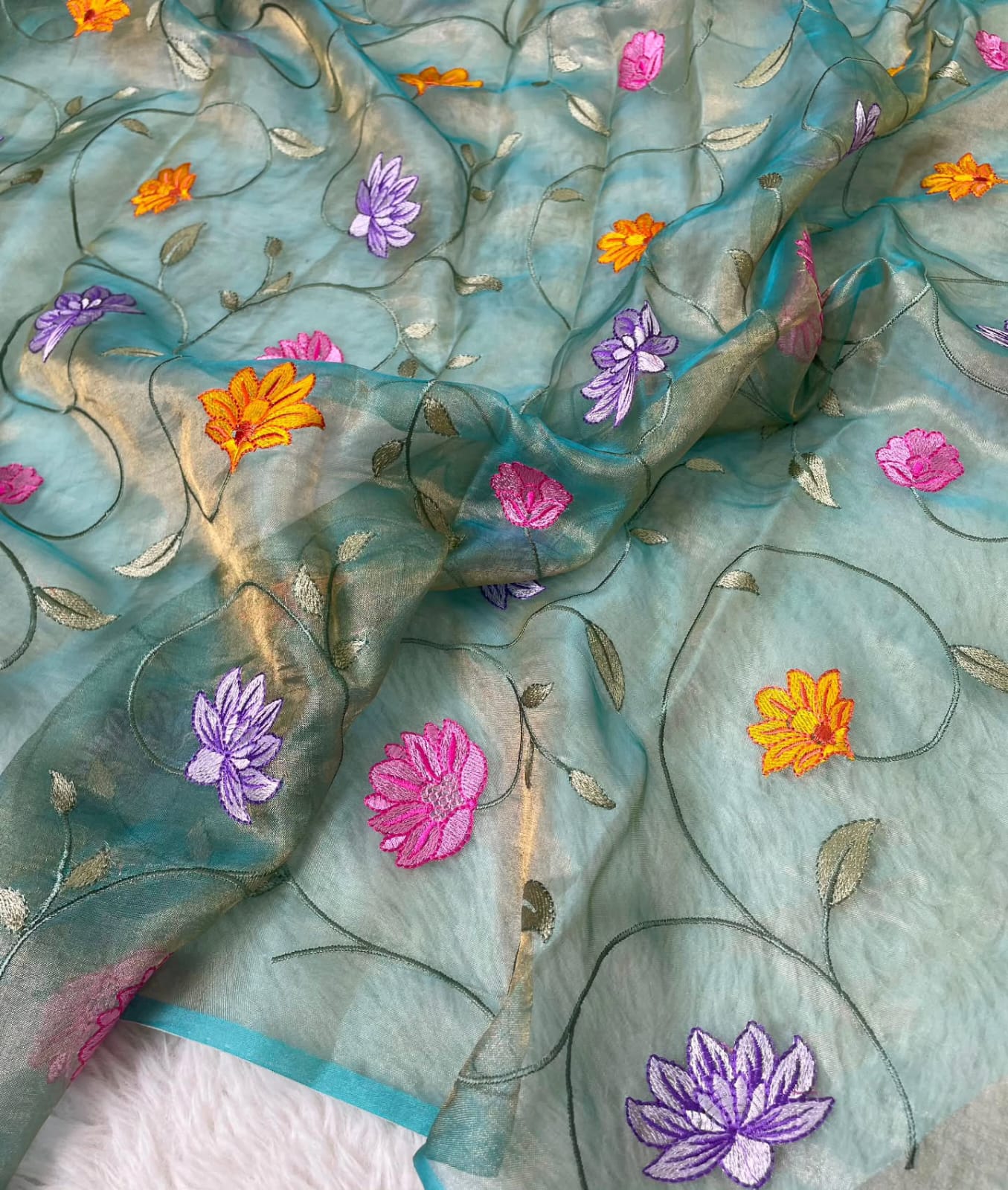 Banarasi Pure Tissue Saree adorned with intricate embroidery, enriched with luxurious silver zari weaving.